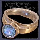 10 Karat Yellow Gold, Sterling Silver and Sky Blue Topaz 'Bliss' Ring Image