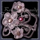 10 Karat Yellow Gold, Sterling Silver and Mozambique Garnet 'Feelin' Groovy' Ring Image