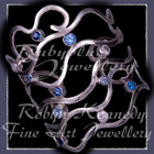 Sterling Silver, Multi Blue Topaz's and Cubic Zirconia's 'Seiche' Bangle Bracelet Image