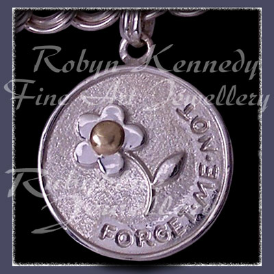 14 Karat Yellow Gold and Sterling Silver Forget-Me-Not 'Engraved Medallion' Charm Image