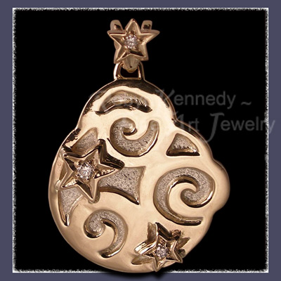 10 Karat Yellow Gold and Steling Silver Pendant Accented with Diamond Set Stars Image