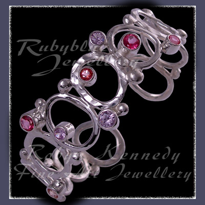 Sterling Silver, Various Pink Topaz and Lavendar Cubic Zirconia's 'Pretty in Pink' Bracelet