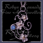 10 Karat Yellow Gold, Sterling Silver and Sky Blue Topaz 'Feeling Groovy' Pendant Image